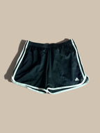 adidas Marathon 20 black running shorts with white 3-Stripes, displayed flat against a solid beige background.