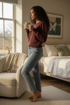 A woman wears a Banana Republic burgundy Italian Merino puff-shoulder sweater front