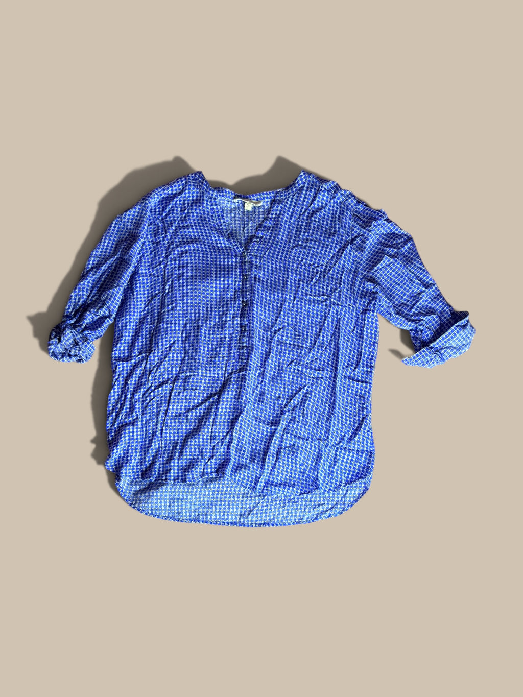 Grand & Greene royal blue and off-white geometric print high-low blouse shown in a front flat lay