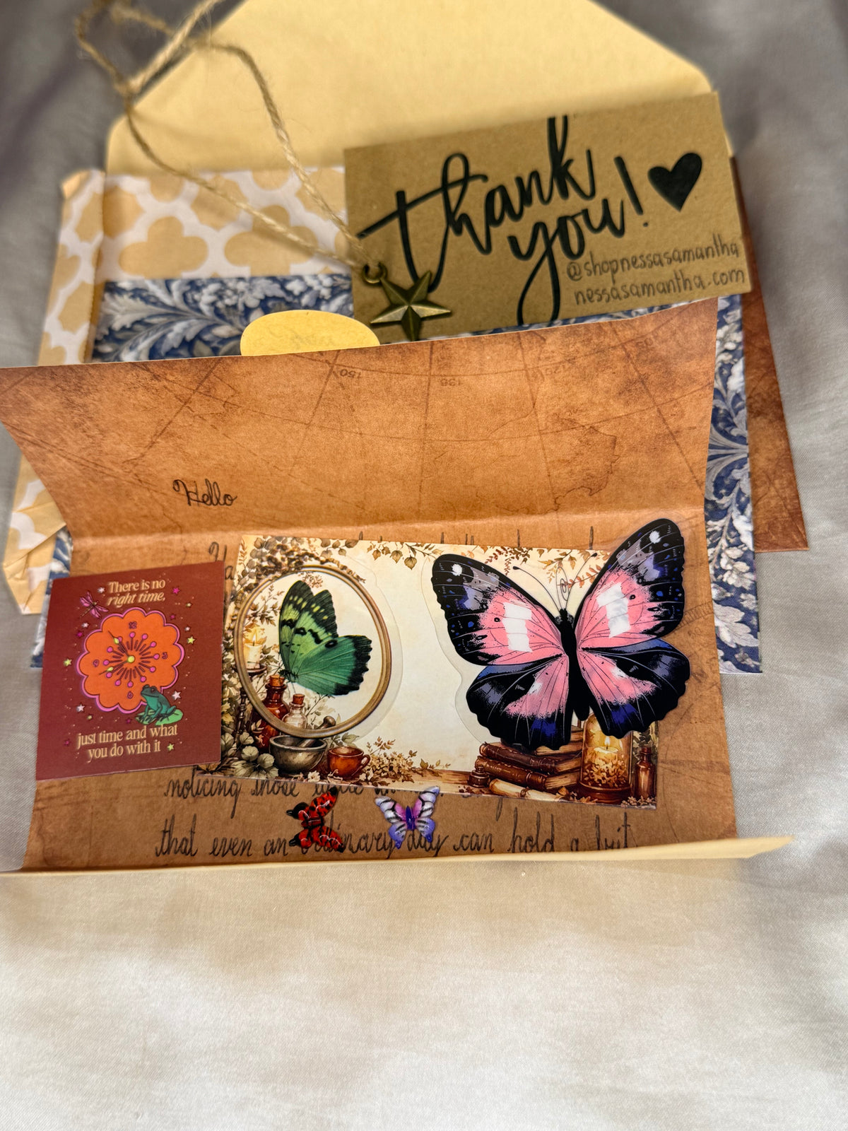 A spread of handwritten snail mail contents from Nessa Samantha, showing an example arrangement of the letter and decorative stationery, with contents varying by order.