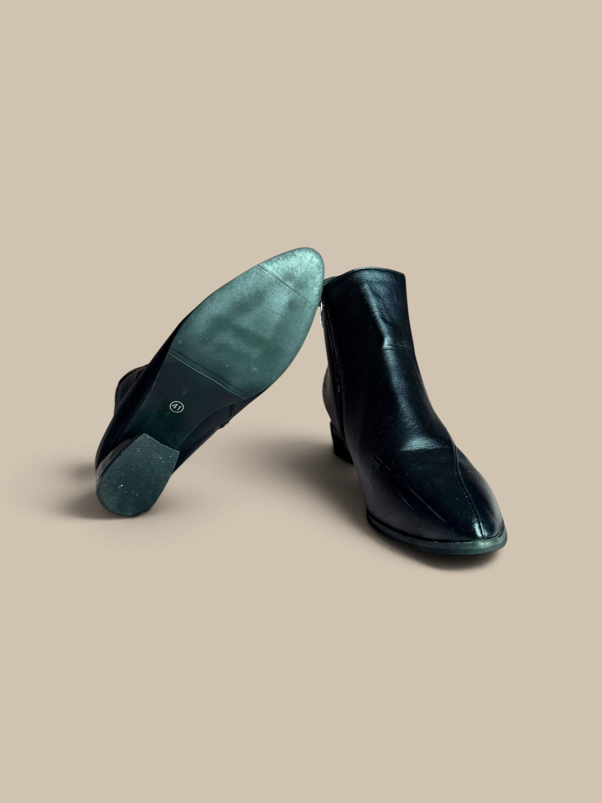 Nessa Samantha black ankle boot showing textured sole and metallic heel detail