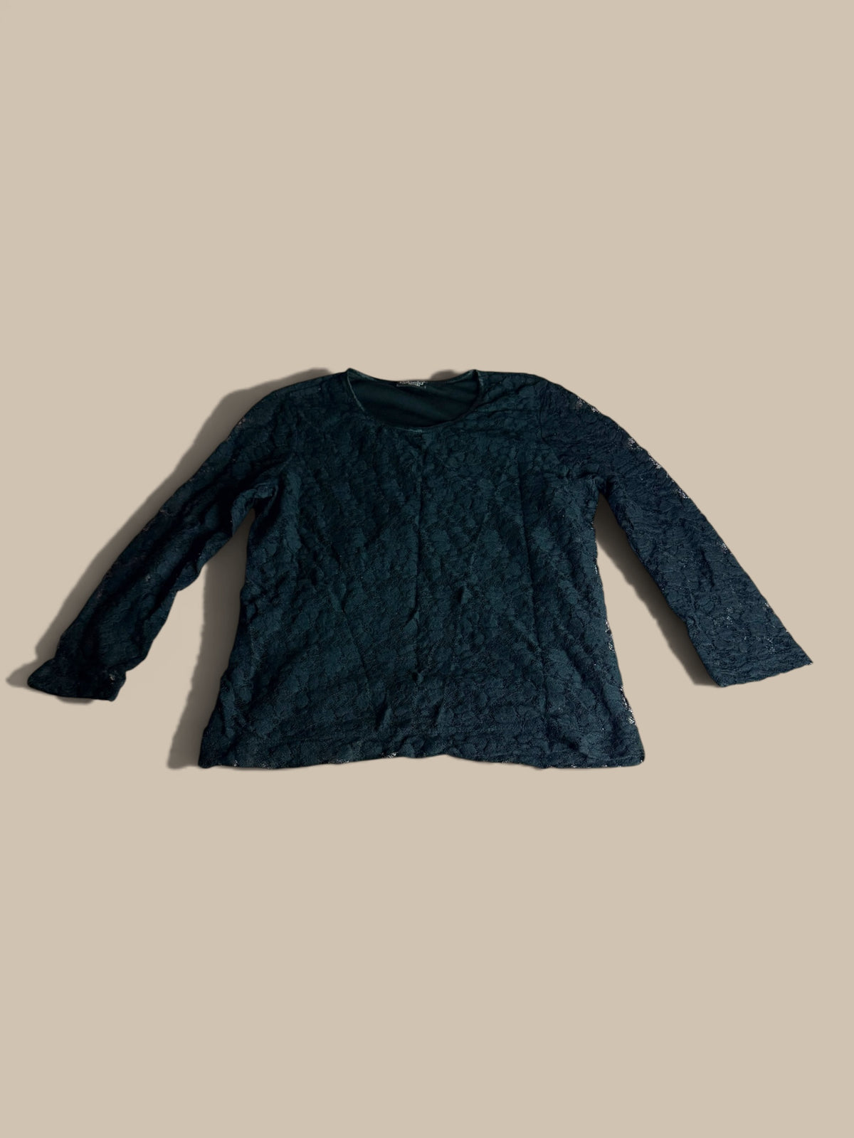 A Rafaella black floral lace petite top shown in a second front flat lay on a solid beige background.